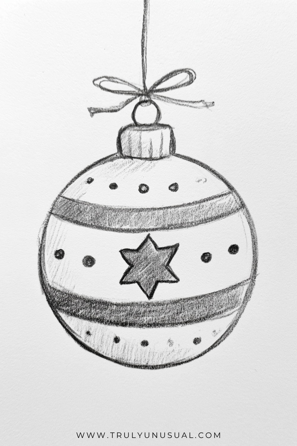 Easy Christmas bauble pencil drawing featuring a round hanging ornament decorated with a star, stripes, and dots.