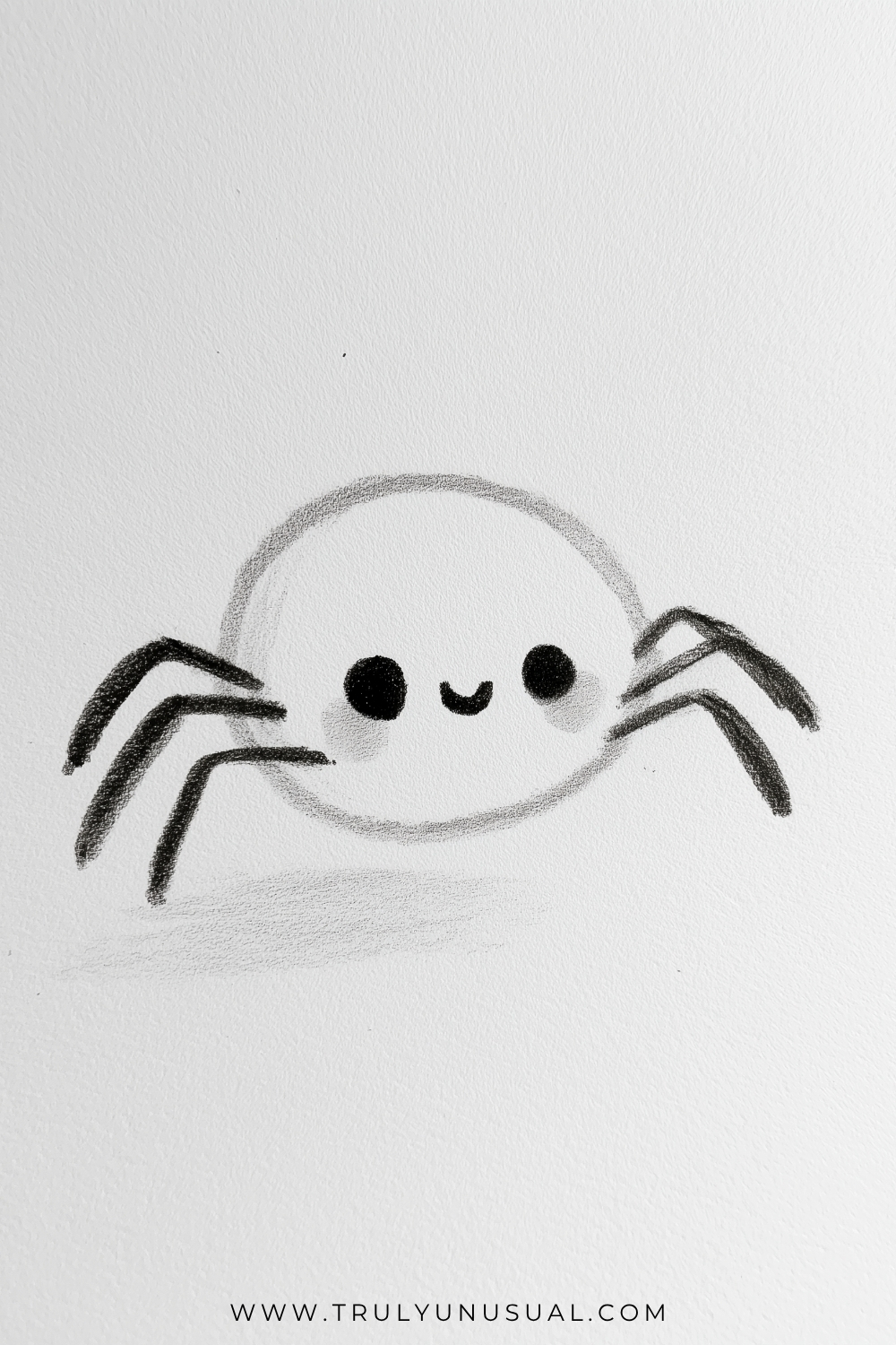 Pencil drawing of a smiling cartoon spider with a large round body, two dark oval eyes, a tiny curved mouth, and lightly shaded cheeks. Three angular legs extend from each side in this simplified design, with darkened tips and a soft shadow beneath the body.