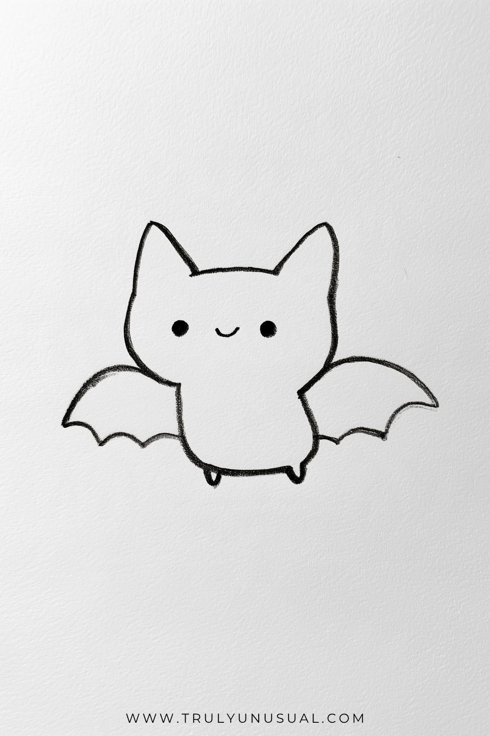 Bold outline drawing of a tiny smiling bat with tall pointed ears, small dot eyes, and a short rounded body. Its wings spread to either side with curved upper edges and scalloped lower edges, while two little feet project beneath its unshaded body.