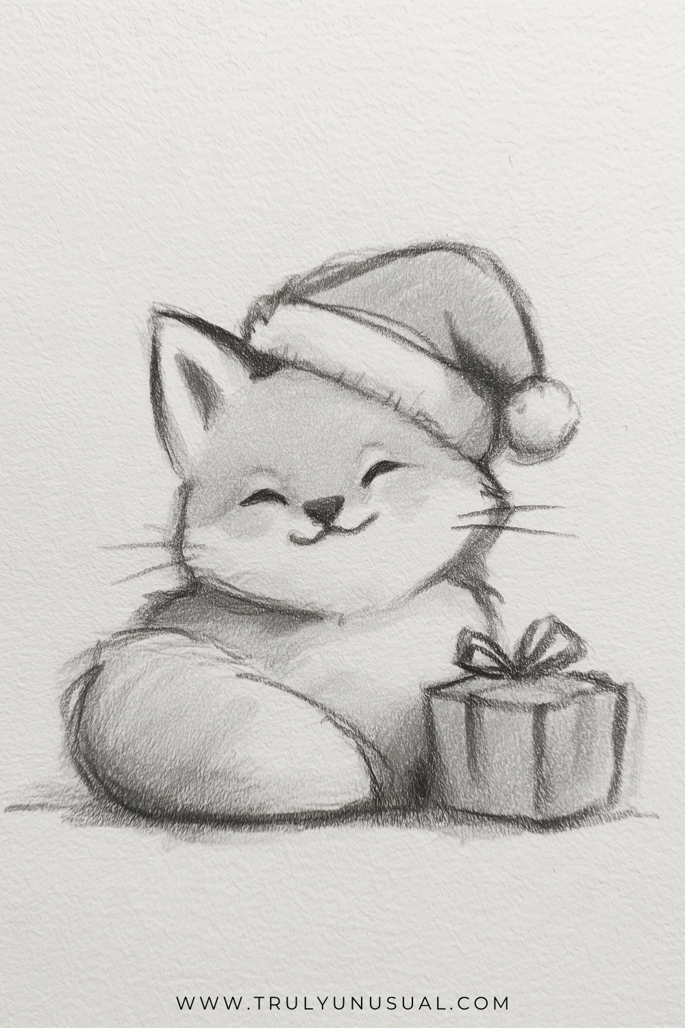 Cute Christmas fox pencil drawing featuring an adorable fluffy fox wearing a Santa hat with a pom-pom, sitting beside a wrapped Christmas present topped with a ribbon and bow. The fox has pointed ears, closed smiling eyes, a tiny black nose, delicate whiskers, and a large bushy tail curled around its body. Soft graphite pencil shading creates a cozy, hand-drawn Christmas illustration on textured white paper, perfect for cute and easy Christmas drawing inspiration.