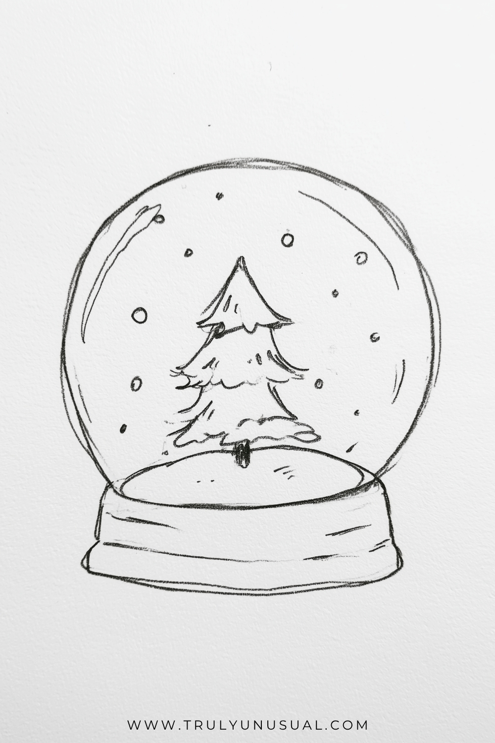 Easy Christmas snow globe pencil drawing featuring a small evergreen tree with three layers of branches standing inside a large round glass dome. Tiny circles and dots representing falling snow surround the Christmas tree, while curved pencil lines suggest reflections on the glass. The snow globe rests on a simple rounded rectangular base, with light sketch shading and delicate black pencil outlines on a white paper background.