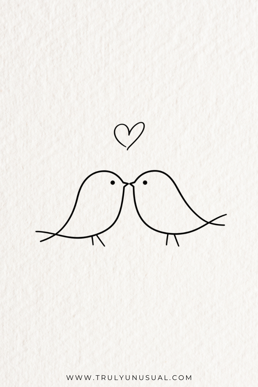 Black outline drawing of two rounded birds facing each other with their beaks touching. Each bird has a dot eye, a narrow pointed tail and two tiny feet; an outlined heart floats centrally above them on white textured paper.
